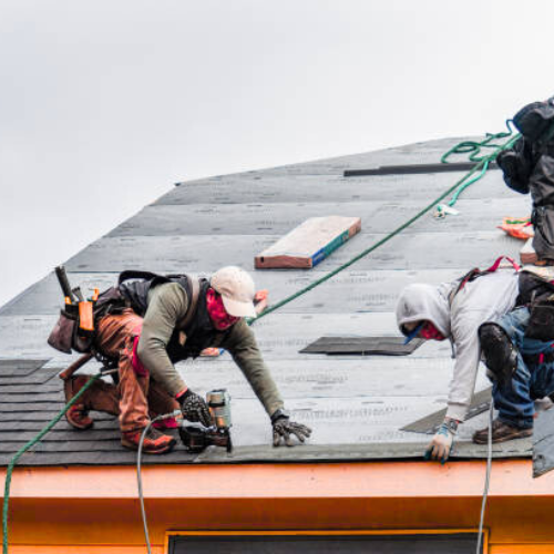 A roofing crew working on a jobsite