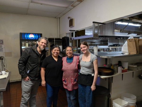 Ben with Elsa, Blanca and the crew in their restaurant kitchen in Idaho Falls