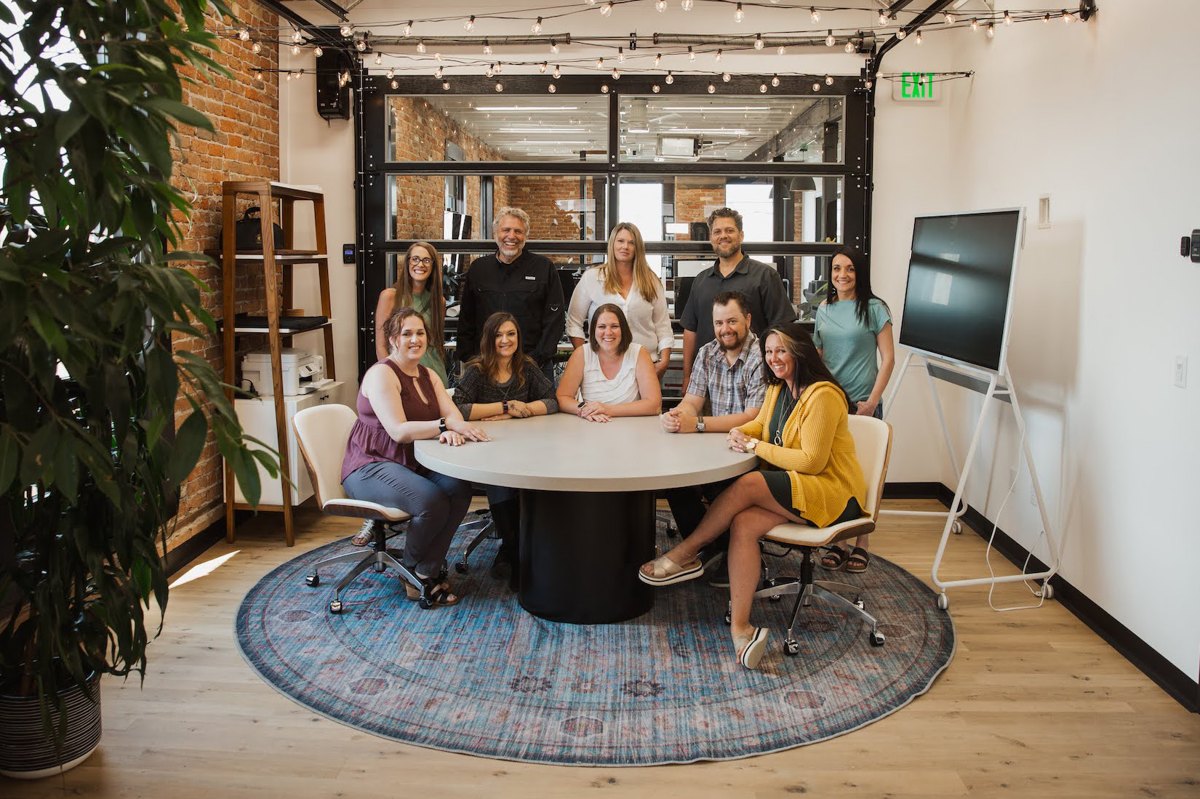 Ben and the Page Insurance team around the office table in Idaho Falls